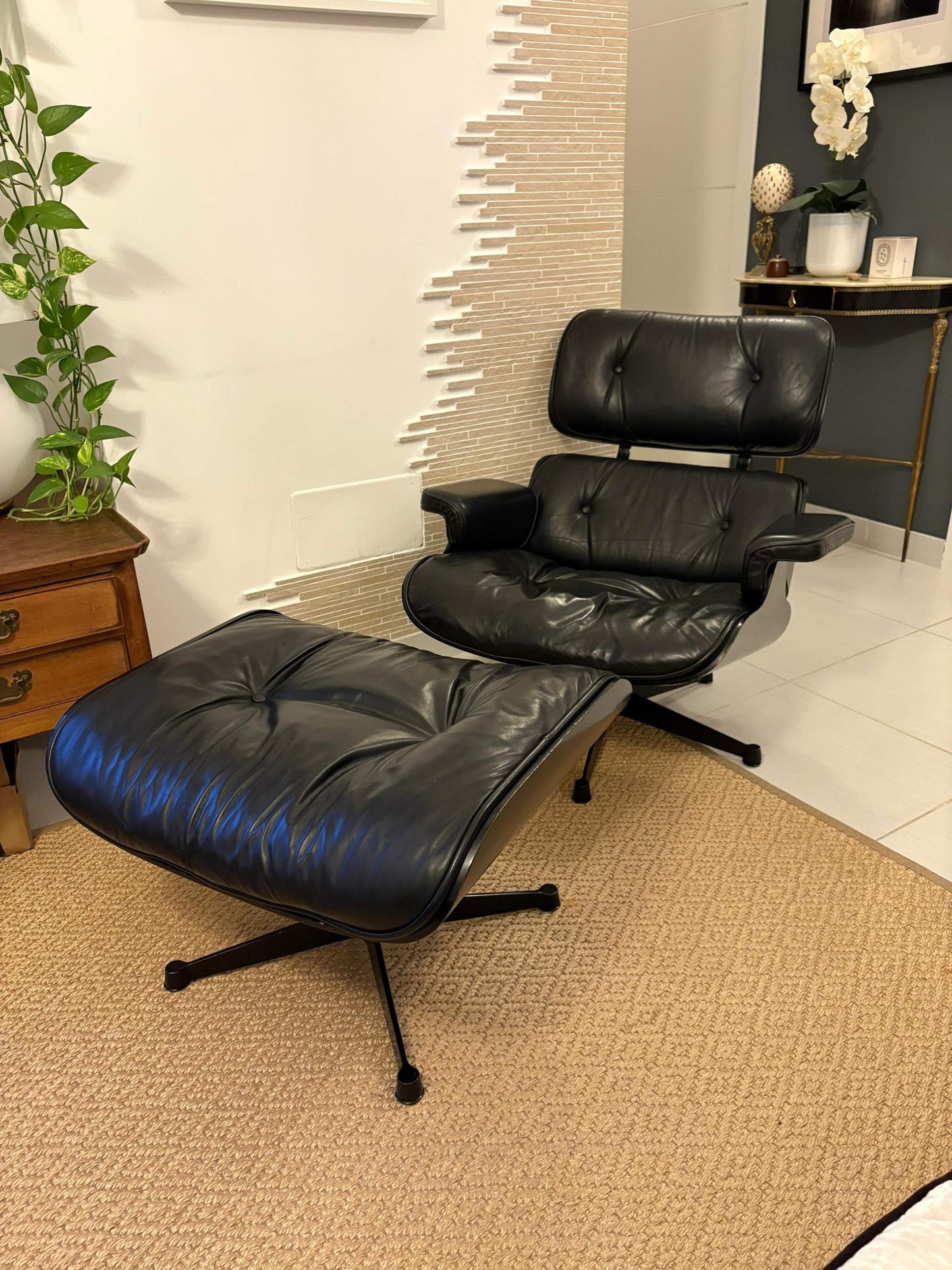 Black Eames Lounge Chair and ottoman with leather upholstery and modern design