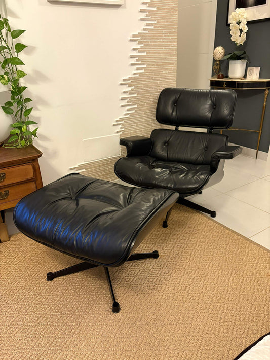 Black Eames Lounge Chair and ottoman with leather upholstery and modern design